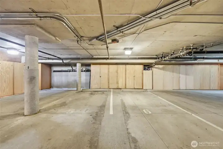 Two dedicated parking spaces and lots of storage behind.