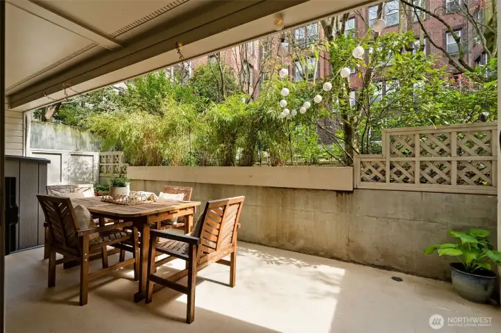 Rare, beautiful outdoor oasis! Enjoy al fresco dining, container gardening, or take a WFH meeting on your spacious patio.
