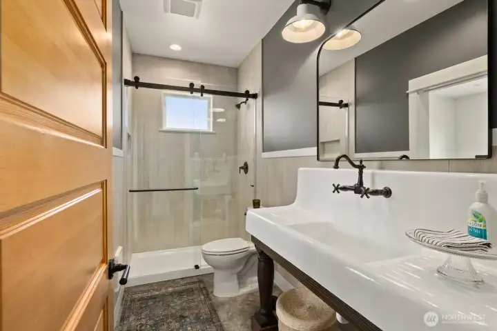 Bath in guest quarters of shop