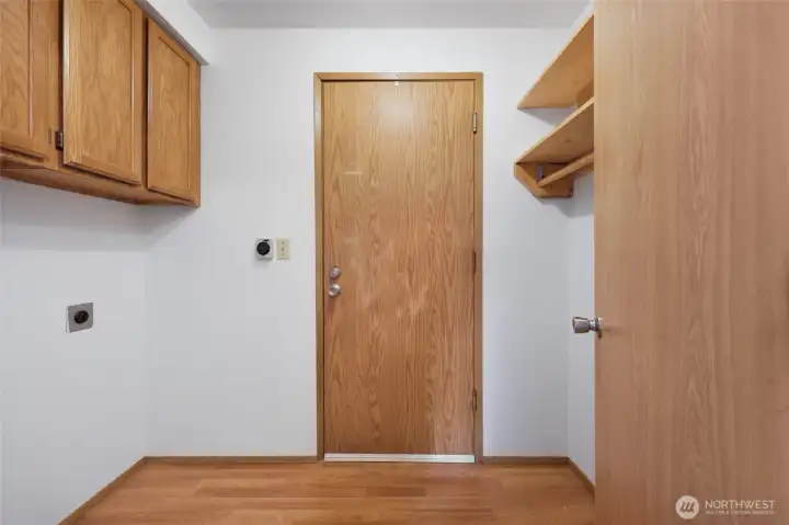Laundry room leading to garage.
