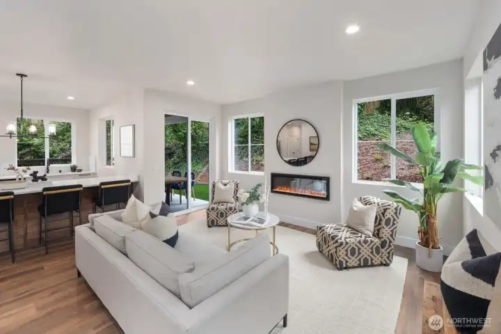 Living room area offers a lot of windows, inviting the natural light in the space. Electric programmable fire place to add that special ambiance. Living room area offers a lot of windows, inviting the natural light in the space. Electric programmable fire place to add that special ambiance.