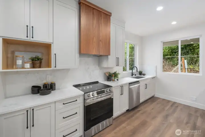 Loving the window over the large sink and at the end of the kitchen overlooking the outdoor patio flooding the kitchen with natural light. Loving the window over the large sink and at the end of the kitchen overlooking the outdoor patio flooding the kitchen with natural light.