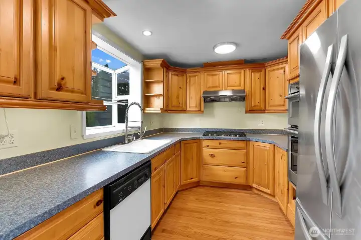 Bright Kitchen with Stainless Steel appliances and a gas stove. Bright Kitchen with Stainless Steel appliances and a gas stove.