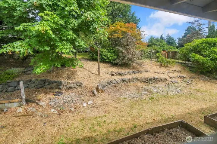 Terraced backyard with raised garden beds. Terraced backyard with raised garden beds.