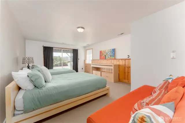 3rd Bedroom downstairs with sliding glass door