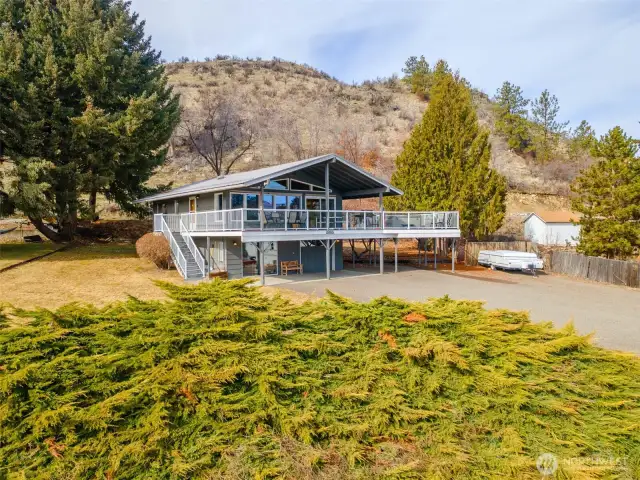 Metal Roof. Large covered wrap around deck. Covered patio and parking.