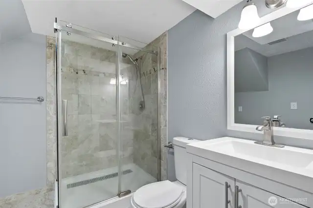 Stand up tile shower in apartment bathroom