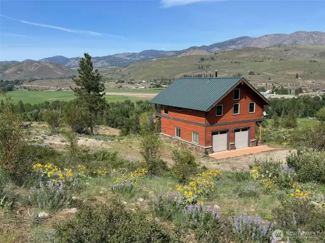 Breathtaking vistas from every angle of the home and lot. Beautiful natural landscaping with wild meadows and open views, covered in wildflowers