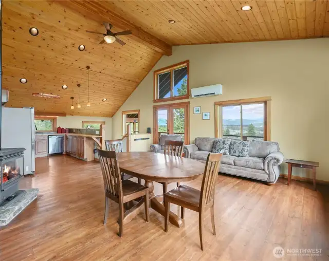Dining area comfortably fits a large table and opens to kitchen and living