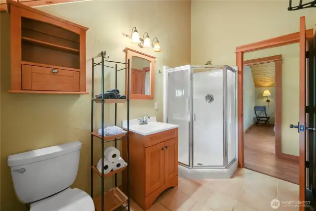 Bright and tidy full bathroom with walk-in shower