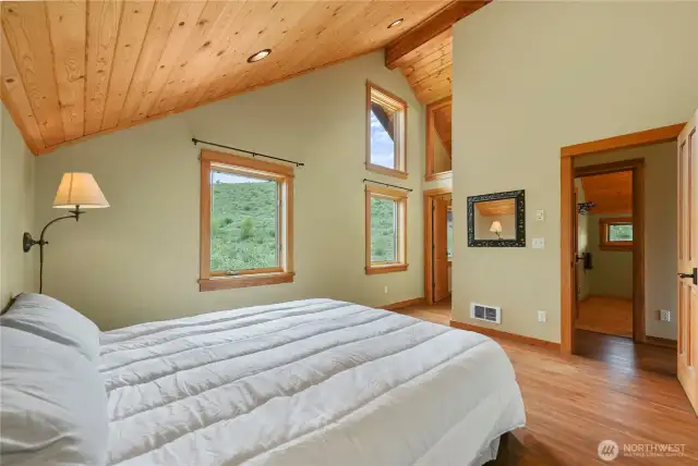 Two large windows frame serene territorial views