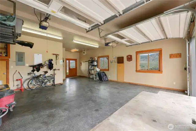 Two garage doors, extra storage rack, utility room and laundry room. Quality enough to convert to living area.
