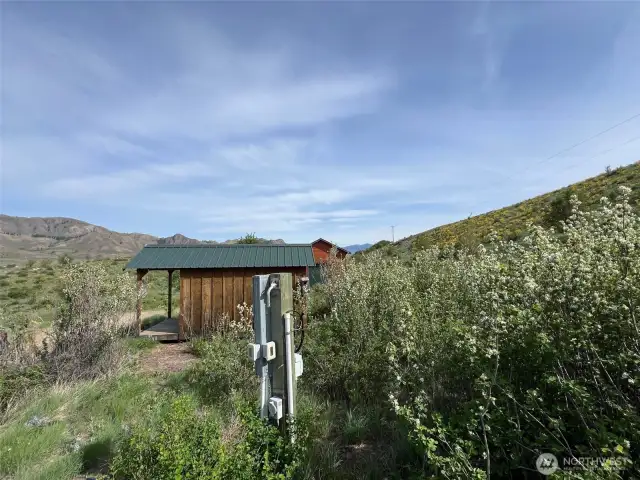 Garden shed for tools and small outdoor projects. Includes a good producing well with a cistern system.