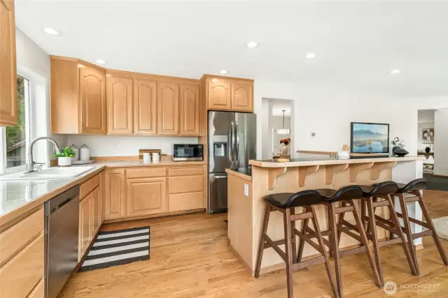 Main Floor Kitchen with access to Dining ROom, Laundry, and Foyer