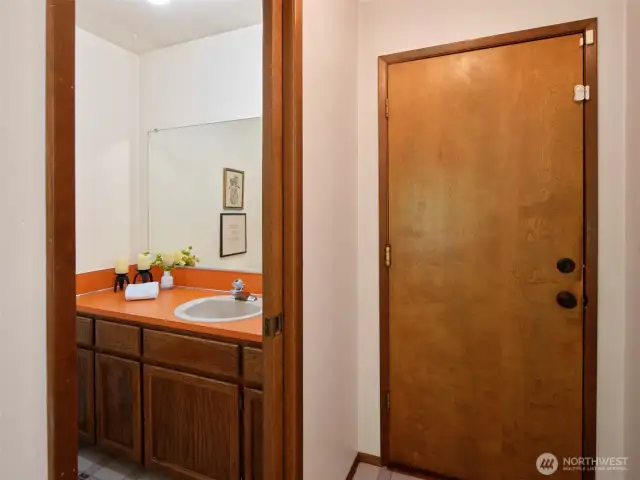 1/2 Bath off between Family Room & Garage