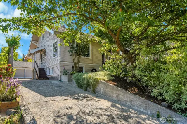 This house has lots of off-street parking, and the detached garage (new roof) could also serve as a workshop.