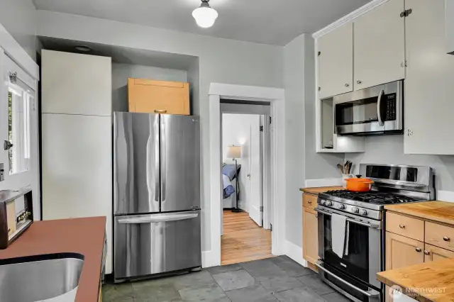 Stainless appliance and a gas range.