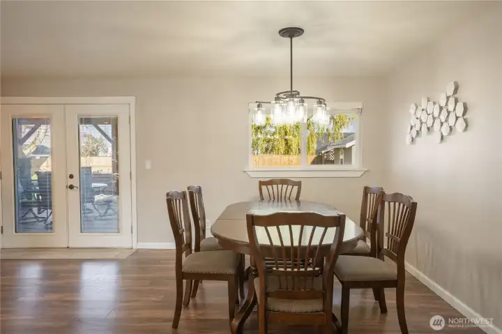 Spacious dining room, with French doors leading out to the back patio