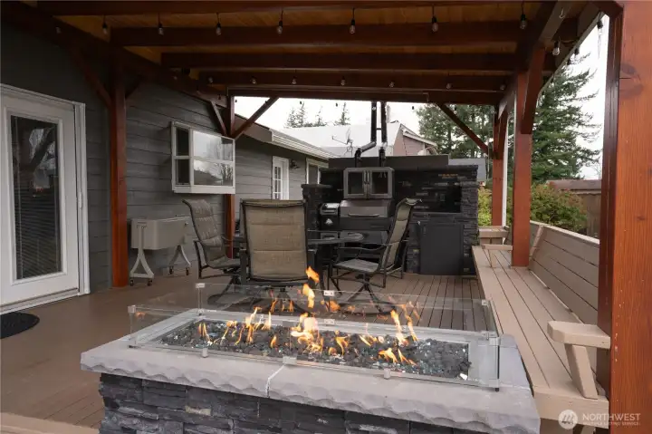 Beautiful built in stone firepit, and outdoor cooking area