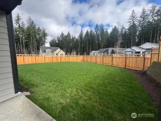 Expansive back yard space, fenced in.