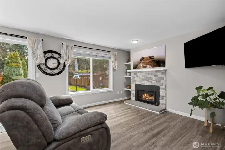 Spacious living room with beautiful stack stone gas fireplace