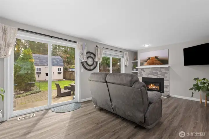 Living room area looking out to fully fenced backyard