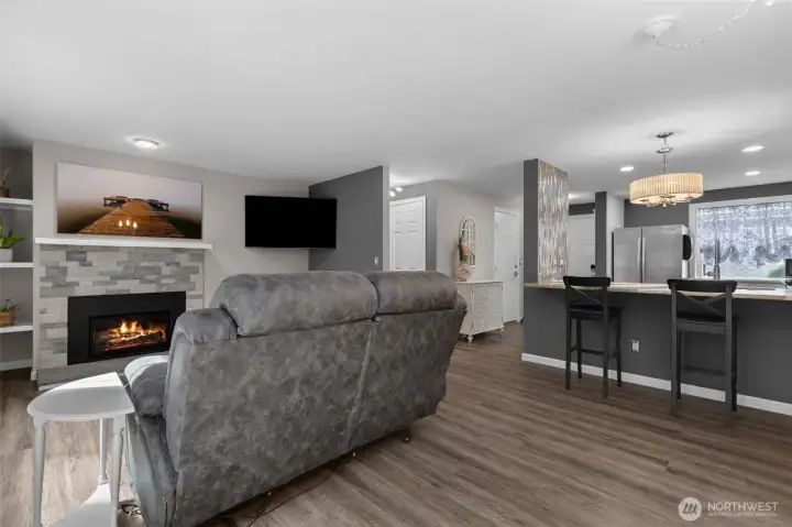 Patio slider looking back towards spacious living room with updated kitchen