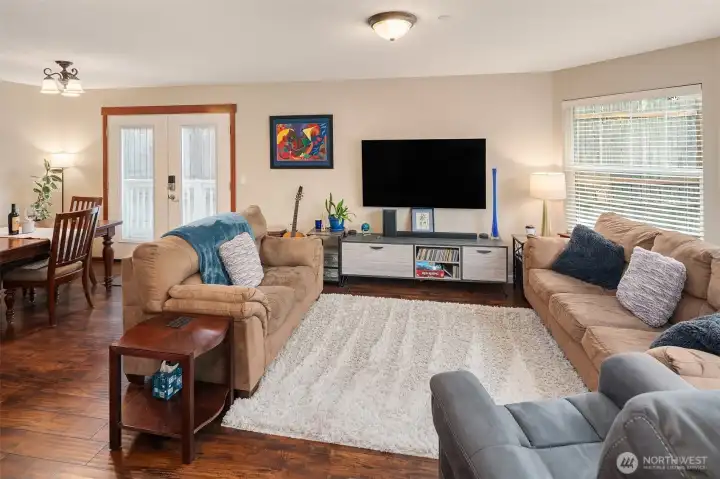 Warm and inviting, this area allows for relaxing, imaginative furniture layout options, and room for activities. The french doors lead to the accessible ramp or to the secluded patio. :)