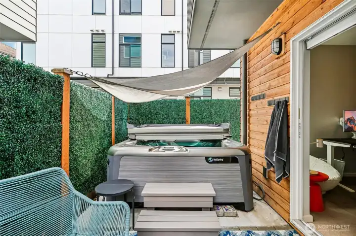 Private outdoor patio with hot tub and plenty of space for a garden.