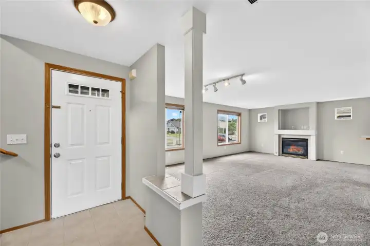 ENTRY  Covered exterior entrance  Tile floor  Storage / Coat closet under stairs