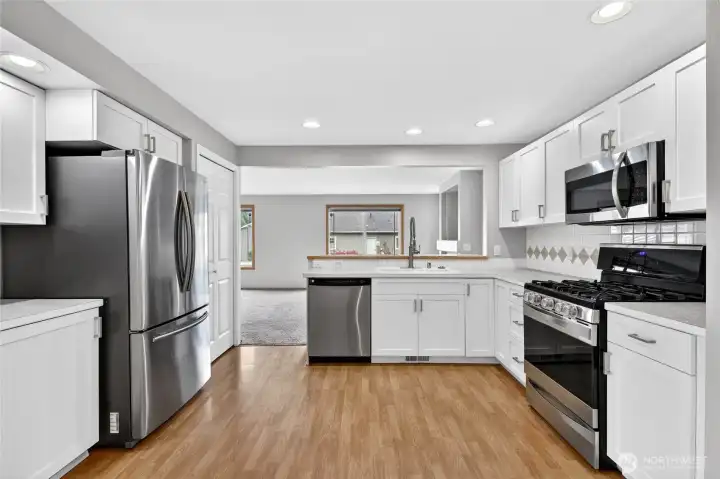 Samsung Stainless side by side frig with freezer drawer & ice maker  Kenmore Elite Stainless 4 burner gas cooktop with oven   Kenmore Stainless dishwasher