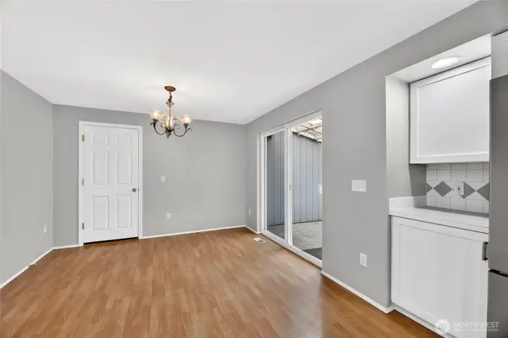 Pantry / Large eating Space / Recessed lighting  Slider leads out to rear yard with covered patio