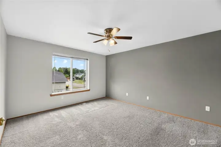 PRIMARY SUITE  Large bedroom with picture window