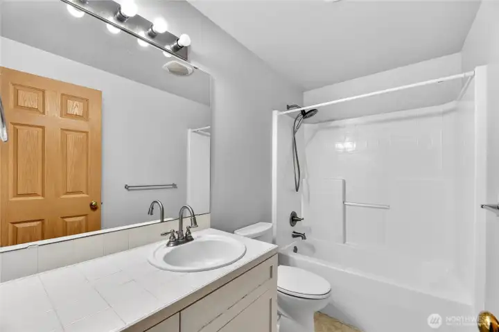 FULL HALL BATH with tile counters