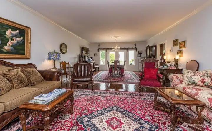 Warm and inviting B & B living spaces with hardwood floors and French doors to the back patio.