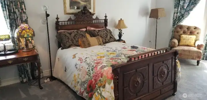 Light filled main floor bedroom designed for comfort and relaxation.