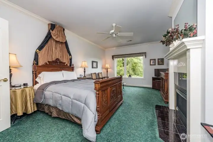 Large guest suite with a romantic fireplace, filled with charm.