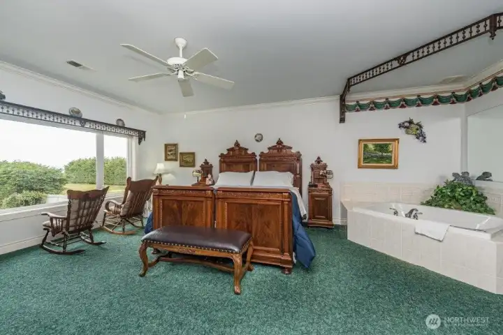 Another suite with a view and jetted tub. Every guest room offers its own unique charm.