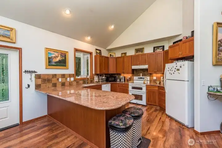 A peninsula island with eating bar in the guest house kitchen is perfect for quick grab and go meals.