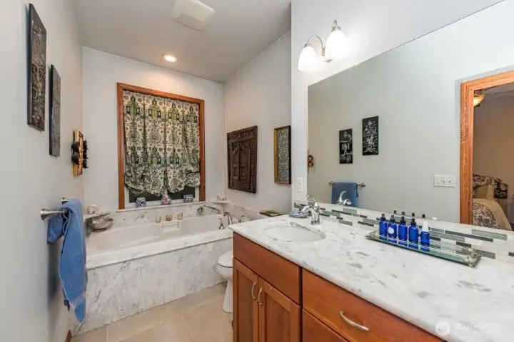 Guest house bathroom with a large soaking tub.