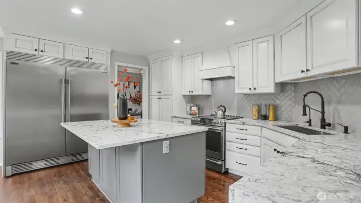 Remodeled kitchen - Custom kitchen cabinets with double drawer soft close, Updated lighting under cabinets, uppers, and island, New water filtration system, and Full-size stainless Frigidaire PRO Refrigerator and Freezer.