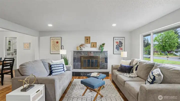 Walk in to the inviting living room with wood-burning fireplace. Walk in to the inviting living room with wood-burning fireplace.