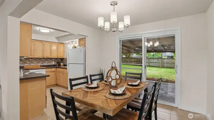 The dining room is centrally located, adjacent to the living room and kitchen, with sliders to backyard. The dining room is centrally located, adjacent to the living room and kitchen, with sliders to backyard.