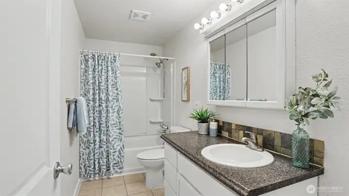 This full bathroom includes a tub-shower combo. This full bathroom includes a tub-shower combo.