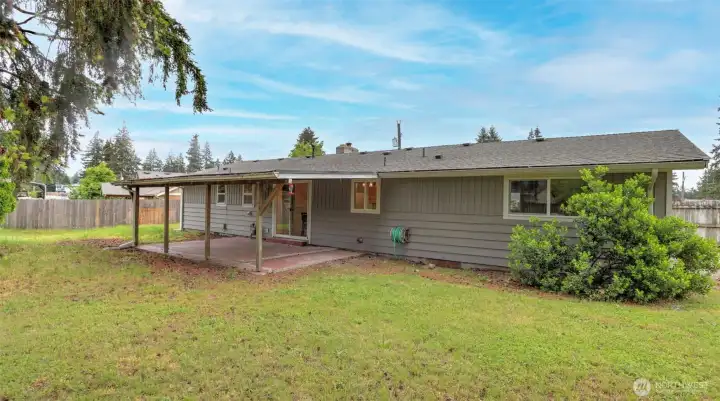 The lush green grounds with mature landscaping offer a serene backyard oasis. The lush green grounds with mature landscaping offer a serene backyard oasis.