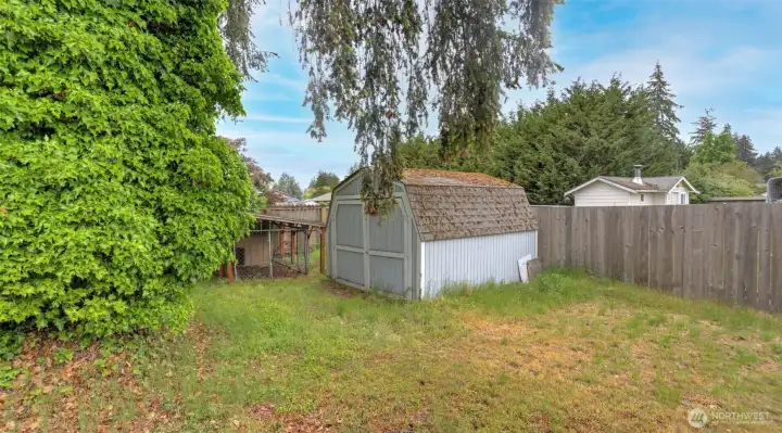 A shed, remaining with the property, provides additional storage. A shed, remaining with the property, provides additional storage.