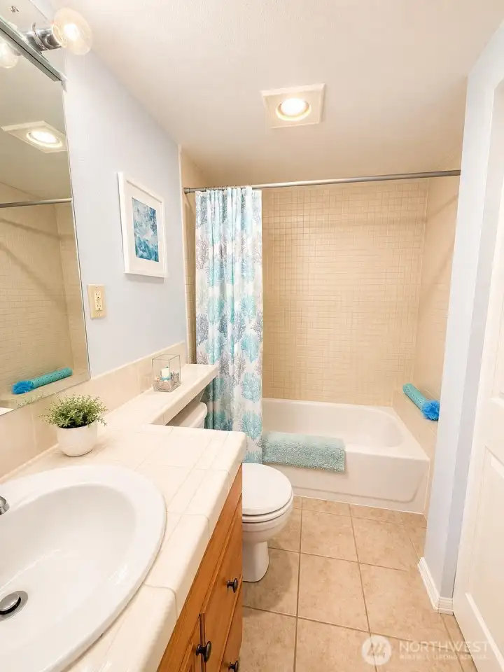 Full bath with lots of storage on Main Floor