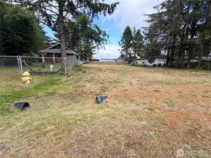 Culvert installed and sewer available for connection at north corner