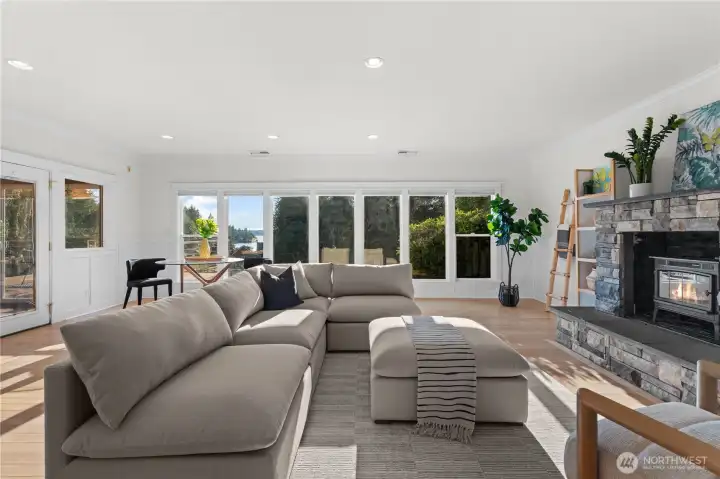 Floor-to-ceiling windows overlooking your acre lot and Henderson Bay!