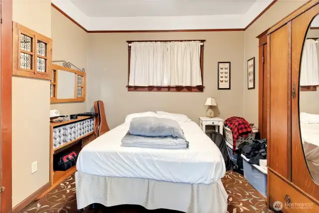 Unit A Bedroom has a closet and Armoire for storage.
